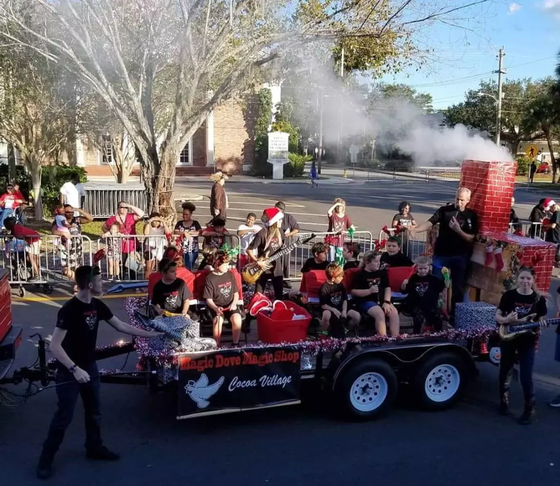 Magician car at the carnival with people