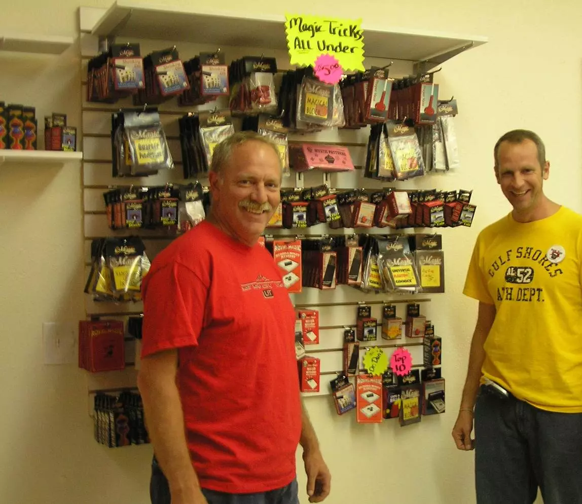 A man at the store with magic trick products